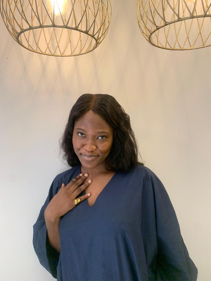 Oluwatumininu Dada portrait in a plant-themed setting